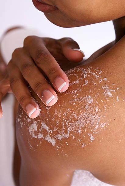 Women rubbing sea moss scrub on skin